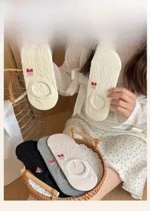 Close-up of thin mesh no-show socks featuring sweet strawberry embroidery and knits