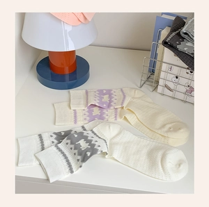 Detail of mesh knit cotton socks with cute cat jacquard and breathable eyelet texture