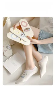 Close-up of breathable mesh cotton socks featuring cute cartoon animal patterns