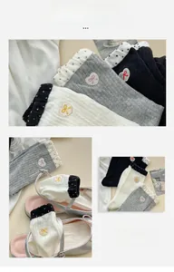 Detailed view of women's ribbed crew socks with heart embroidery and bow pattern