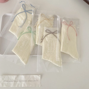 Lot de 5 paires de chaussettes en maille crème avec nœuds colorés style minimaliste