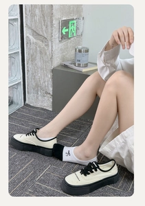 Detail of color-block platform canvas sneakers with logo and white cotton socks