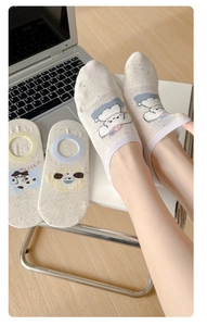 Detail view of cotton invisible boat socks with cute cartoon animals and mesh texture