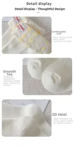 Detail view of cotton socks with ribbon bow, elastic cuff, and flat toe seam design