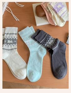 Close-up of summer mesh socks with jacquard dog patterns and hearts in various colors
