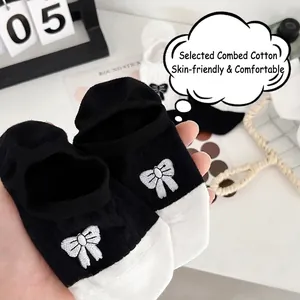 Women's low cut combed cotton boat socks with bow embroidery and black-white contrast