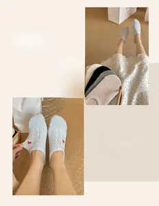 Detail of no-show socks featuring cute strawberry embroidery and ribbed cotton texture