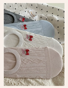 Detail of summer low cut socks with strawberry embroidery and bow knot decor