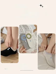 Detail of invisible boat socks with non-slip silicone heel and decorative side buttons