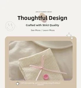 Detailed close-up of ribbed knit socks with pink bow and button decoration