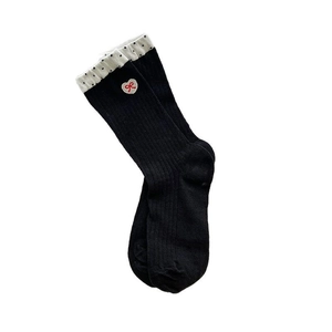 Black ribbed crew socks with white polka dot trim and embroidered heart bow detail