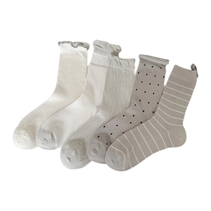 Set of 5 minimalist grey and white cotton crew socks with diverse patterns and textures
