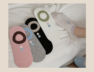 Detailed view of low-cut invisible socks with button embroidery in five pastel colors