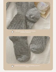 Detail of grey ribbed knit long socks showing flat toe seam and ergonomic heel design