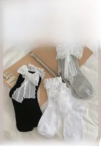 Detailed color display of sweet lolita socks with lace bows in black white and grey