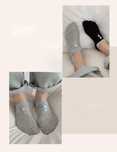 Detailed close-up of cotton low cut socks with dot embroidery and contrast cuffs