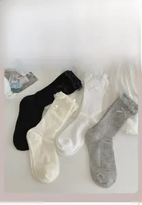 Detailed color display of lace trim socks with bow knots in four classic pastel shades
