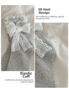 Detail of grey ribbed cotton socks with white lace bow and ruffled trim for Lolita style