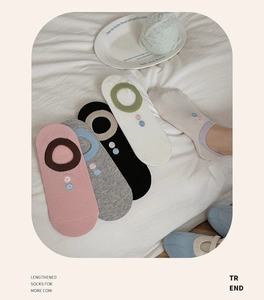 Detail of five pairs of cotton blend invisible socks with color blocking and polka dots