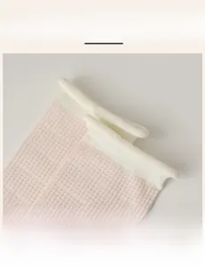 Detailed close-up of high-elastic pink and white striped socks with ribbed cuffs