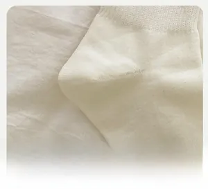 Detail of reinforced heel on cream crew socks featuring premium ballet style knit texture