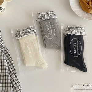Tre paia di calze al polpaccio stile Lolita con bordo a balze a quadretti in bianco grigio nero