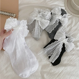 Sweet Lolita style mid-calf socks with large lace bows in white, grey and black colors