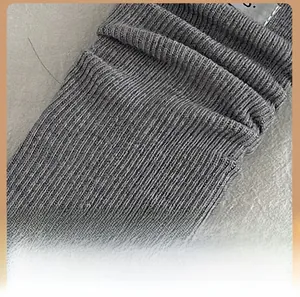 Detail of grey ribbed knit texture and comfortable heel design of the wool blend socks