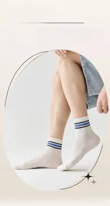 Detail of white cotton athletic crew socks with blue and black stripes for men