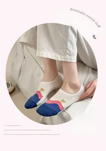 Detail of breathable low cut liner sock with wave stripes and heart pattern decoration