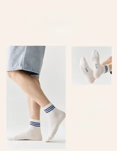 Detail of white striped sports socks showing cotton texture and breathable knit mesh