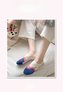 Detail of white low-cut invisible socks with colorful wave patterns and elastic cuffs