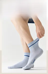 Close-up of light blue striped sports socks showing high elasticity and ribbed cuff