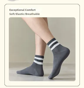 Detail of grey athletic sock with white stripes, FAST logo, soft and breathable cotton knit