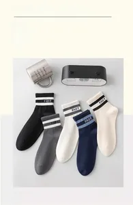 Detailed view of elastic ribbed cuffs with FAST embroidery on men's cotton crew socks