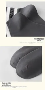 Detail of reinforced sock heel and seamless toe stitching on grey athletic cotton socks