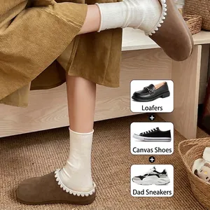Cozy white wool-blend mid-calf socks with elegant wavy ruffled cuffs for women