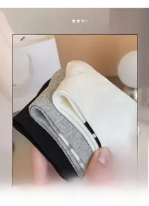 Detailed macro view of soft ribbed texture and high elasticity of cotton mid-tube socks