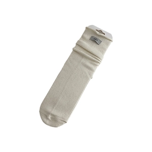 Beige ribbed knit wool socks with egg letter patch and hanging card packaging