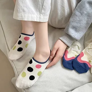 Women's low-cut invisible boat socks with colorful polka dots on beige cotton fabric