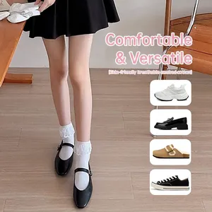 White crew socks for women featuring elegant lace trim and soft combed cotton material