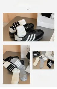 Detailed close-up of striped cotton crew socks in black, white, and grey color set