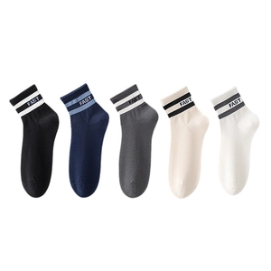 Five pairs of men's cotton crew socks in neutral colors with striped FAST embroidery