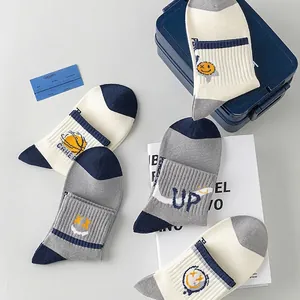 Five-pack men's cotton knit crew socks with smiley face and sports letter patterns