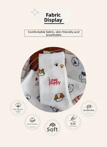 Close-up of white cotton socks featuring cute puppy prints and Love Puppy text detail