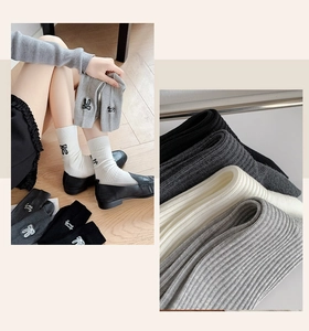 Detailed embroidery of Sweet Candy letters and bow on ribbed cotton mid-calf socks