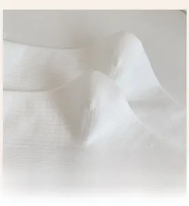 Detail showing the reinforced heel of these white lace ribbed crew socks for durability