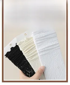 Detailed lace floral texture and ruffled cuffs of ballet style mesh socks in three colors
