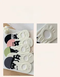 Detail view of 5-pack low cut invisible socks with cute cat prints and non-slip heel grip
