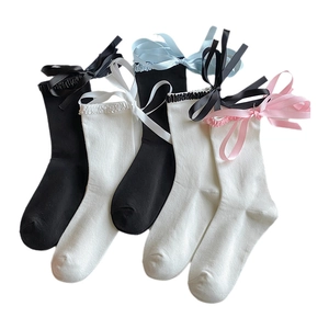 Lolita bow knee high socks with ruffles and ribbons in black white and pink colors